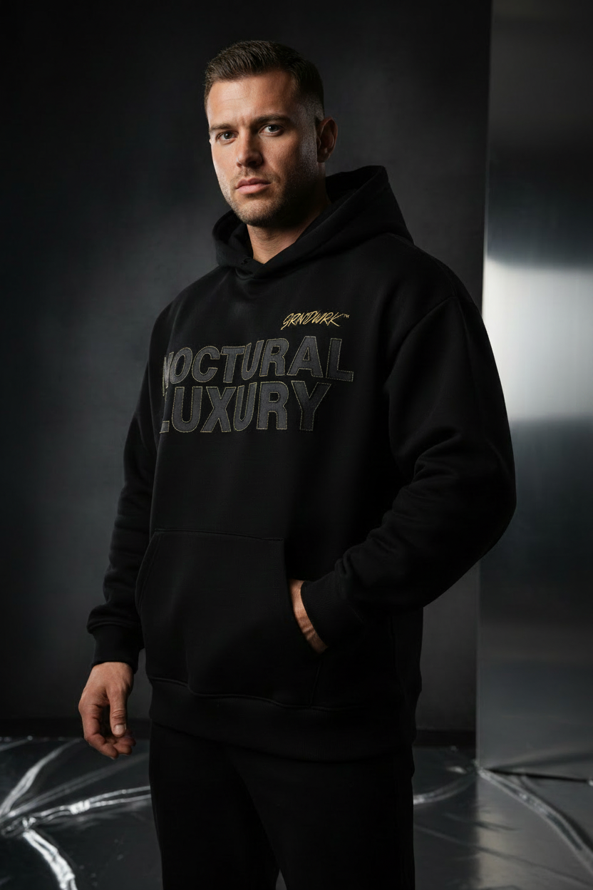 GRNDWRK™ Signature Box-Fit Hoodie front view, jet black with gold embroidered chest logo